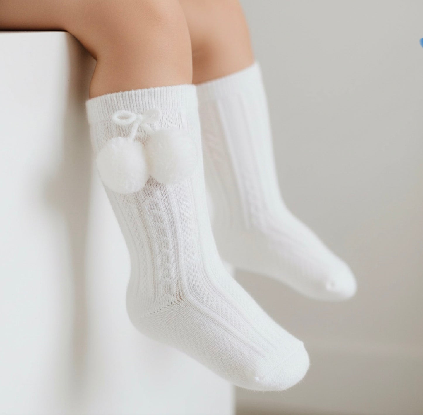 BOBBY baby boys girls knee high pom pom socks in white